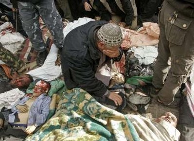 Gazan father weeps before dead son