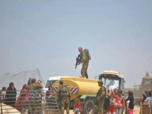 IOF steal Palestinian water tanks