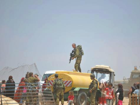 IOF steal Palestinian water tanks